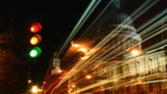 Night-time image of a busy road and traffic lights in a city - Corporate Governance