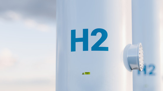 Close-up of hydrogen pipes with H2 written on them